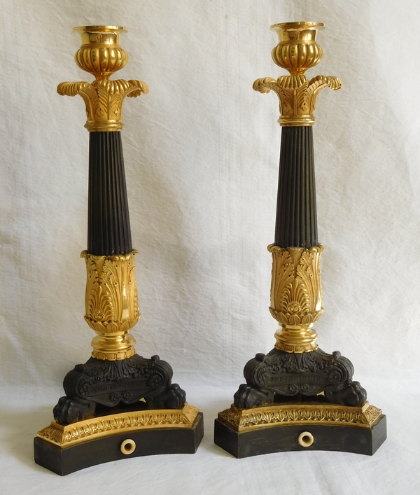 Pair of Empire patinated bronze and ormolu candlesticks, early 19th century circa 1820