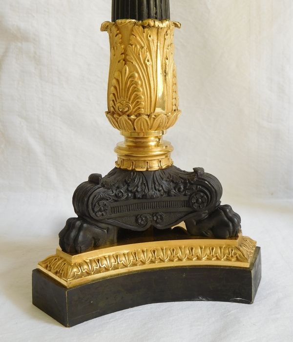 Pair of Empire patinated bronze and ormolu candlesticks, early 19th century circa 1820