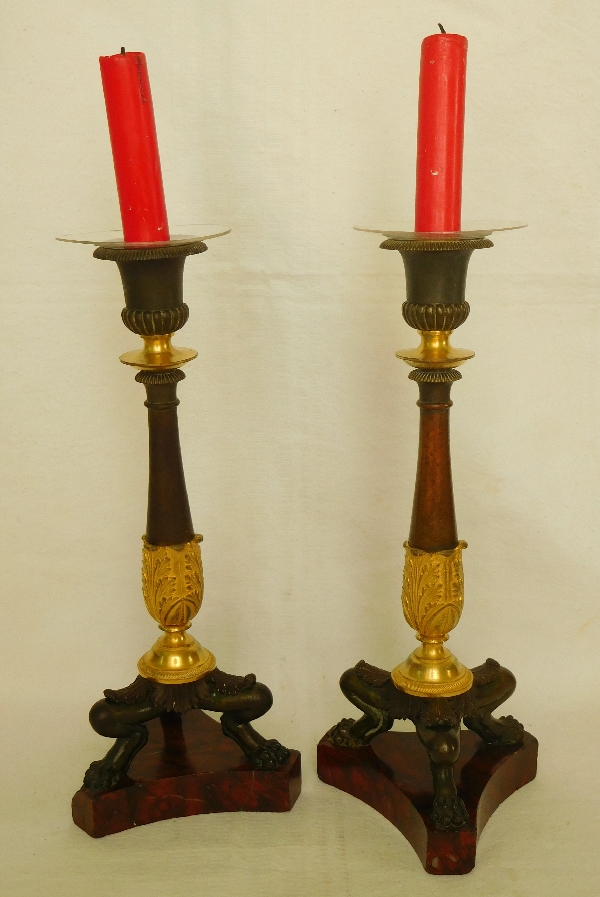 Pair of Empire ormolu, bronze and red marble candlesticks, early 19th century