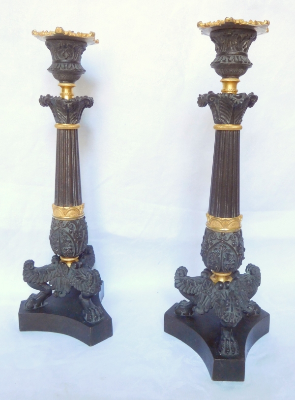 Pair of tripod ormolu and patinated bronze candlesticks, Empire style, early 19th century