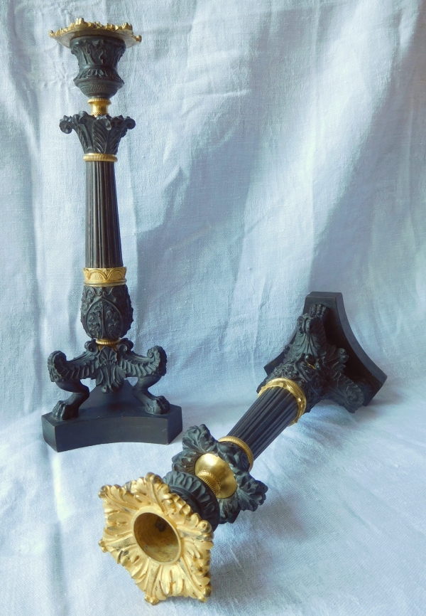 Pair of tripod ormolu and patinated bronze candlesticks, Empire style, early 19th century