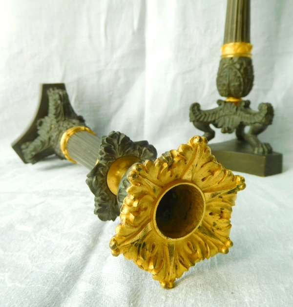 Pair of tripod ormolu and patinated bronze candlesticks, Empire style, early 19th century