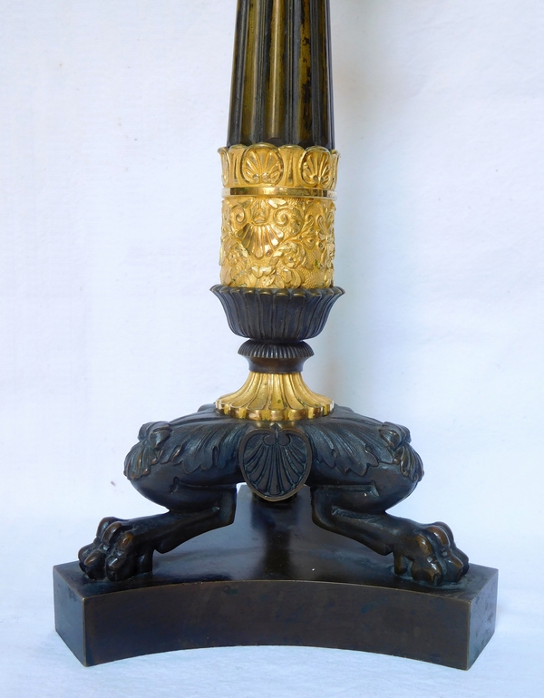 Pair of Empire patinated bronze and ormolu candlesticks, early 19th century circa 1820