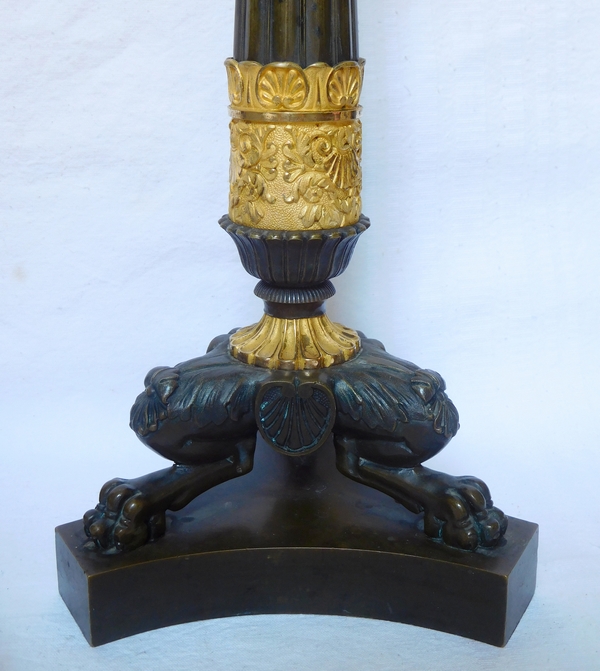 Pair of Empire patinated bronze and ormolu candlesticks, early 19th century circa 1820