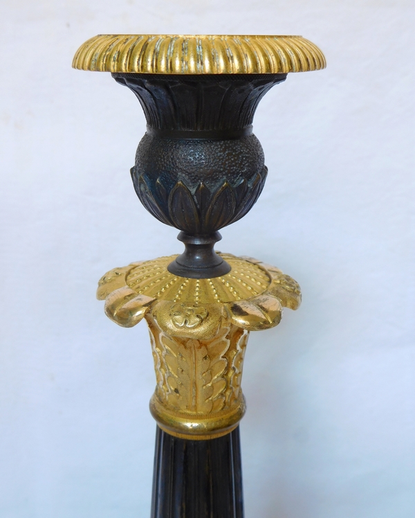 Pair of Empire patinated bronze and ormolu candlesticks, early 19th century circa 1820