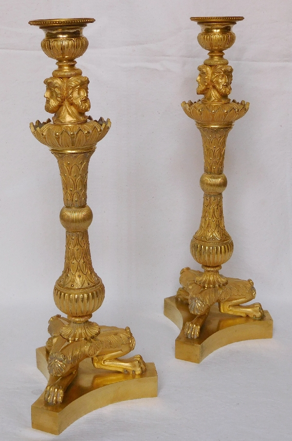 Pair of tripod ormolu candlesticks, late Empire period, early 19th century