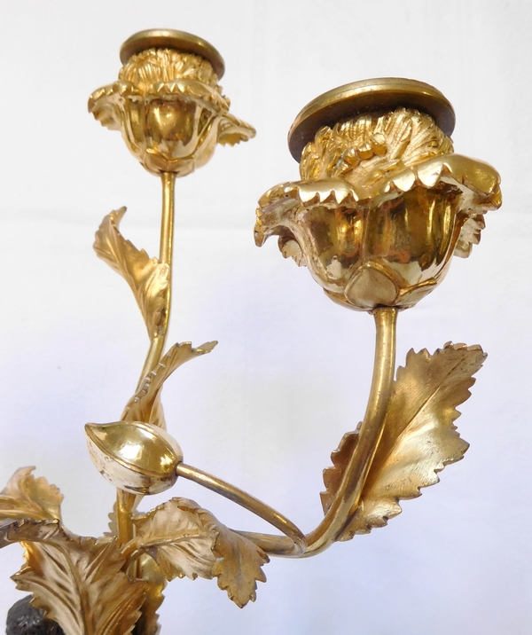 Paire de candélabres aux Romains, bronze patiné et doré, époque Empire