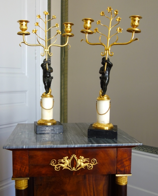 Pair of Empire ormolu, patinated bronze and marble candelabras, 19th century