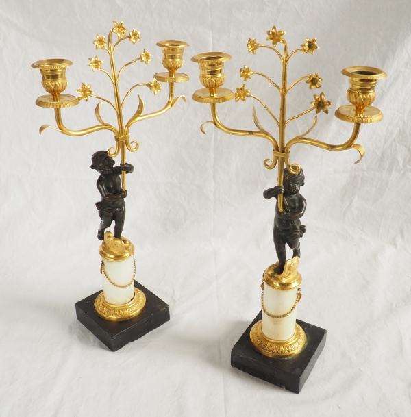 Pair of Empire ormolu, patinated bronze and marble candelabras, 19th century