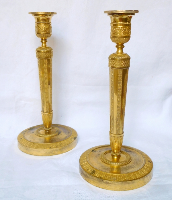 Pair of Empire ormolu candlesticks, early 19th century - 27cm