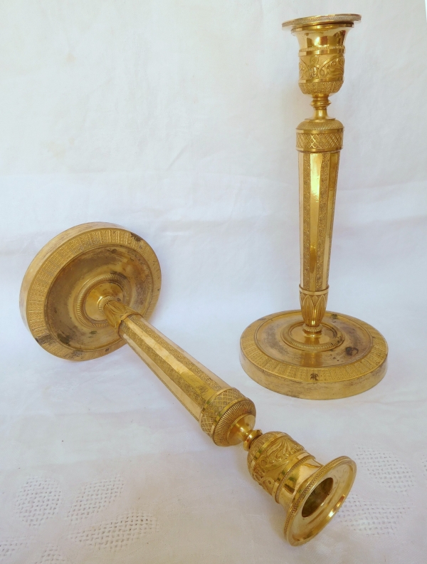 Pair of Empire ormolu candlesticks, early 19th century - 27cm