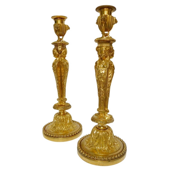 Pair of ormolu Louis XVI style candlesticks, after Jean Demosthenes Dugourc