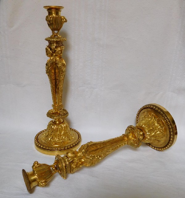 Pair of ormolu Louis XVI style candlesticks, after Jean Demosthenes Dugourc