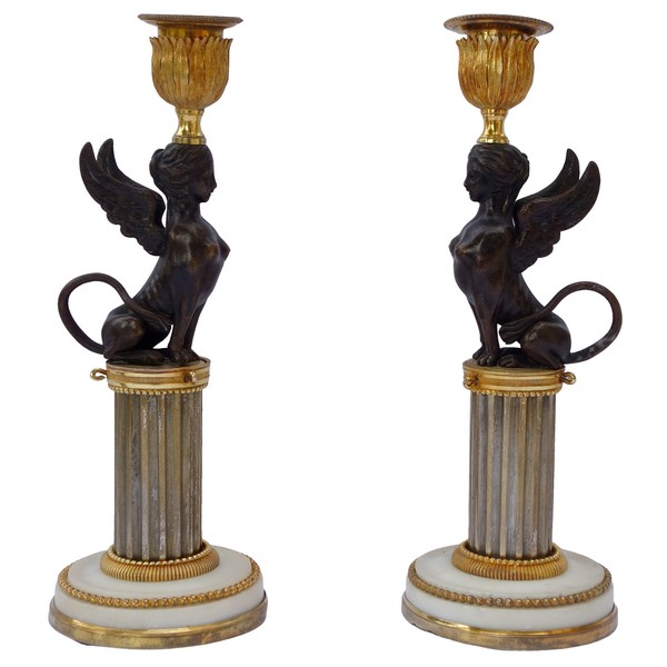 Pair of Directoire ormolu and bronze candlesticks, late 18th century