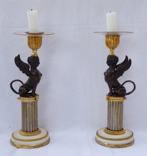 Pair of Directoire ormolu and bronze candlesticks, late 18th century