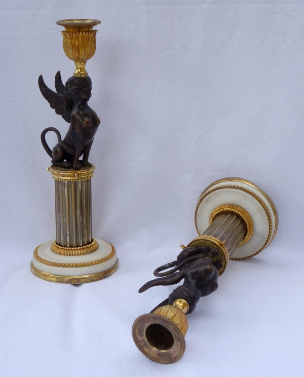 Pair of Directoire ormolu and bronze candlesticks, late 18th century