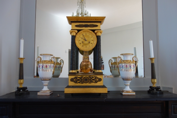 Pair of Empire patinated bronze and ormolu candlesticks, early 19th century circa 1830