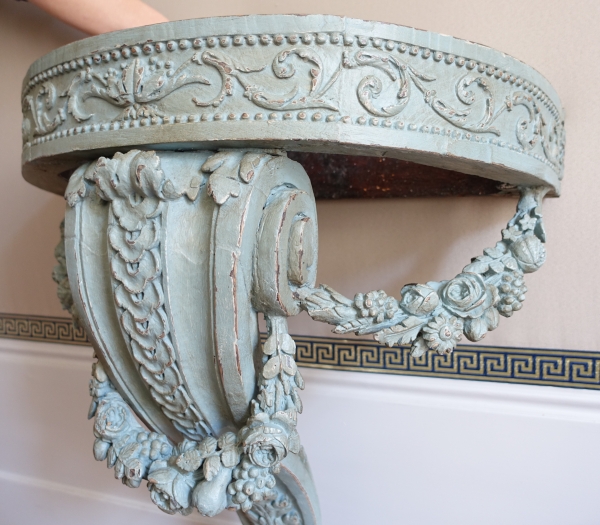 Louis XVI half-moon-shaped console in the taste of Jacob, patinated wood, 18th century
