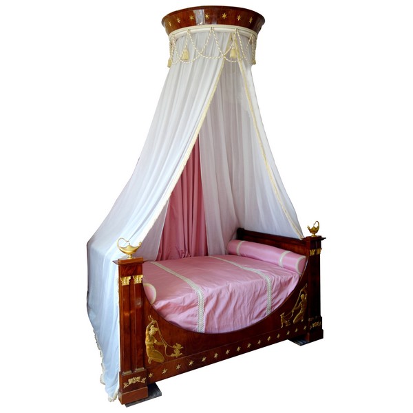 Empire mahogany and ormolu canopy bed and its matching bedside table, early 19th century