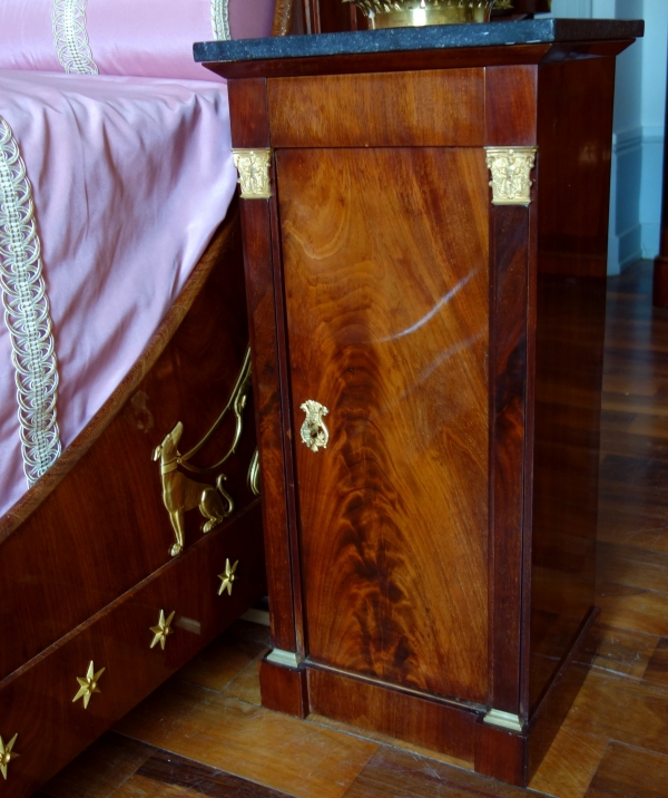 Empire mahogany and ormolu canopy bed and its matching bedside table, early 19th century