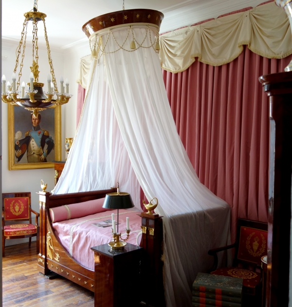 Empire mahogany and ormolu canopy bed and its matching bedside table, early 19th century