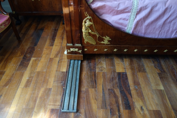 Empire mahogany and ormolu canopy bed and its matching bedside table, early 19th century