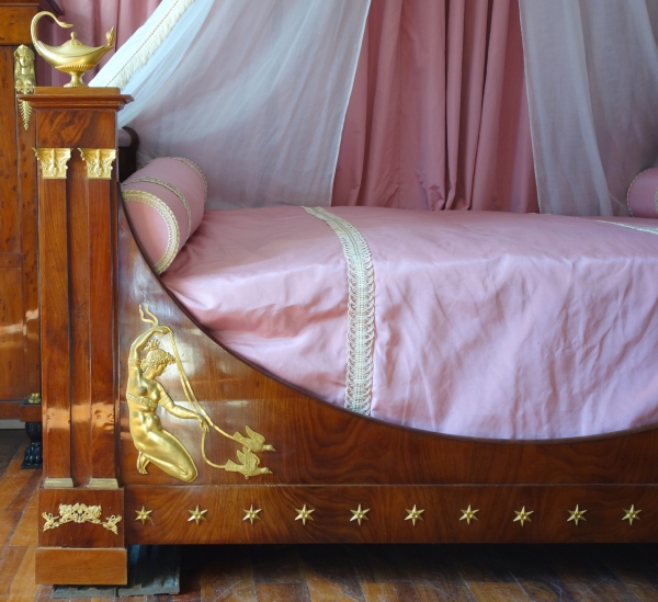 Empire mahogany and ormolu canopy bed and its matching bedside table, early 19th century