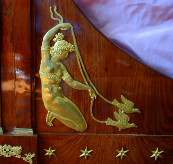 Empire mahogany and ormolu canopy bed and its matching bedside table, early 19th century