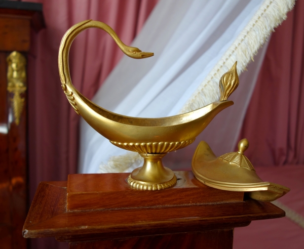 Empire mahogany and ormolu canopy bed and its matching bedside table, early 19th century