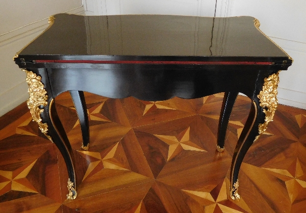 Regency style lacquered wood and ormolu game table / card table, mid 19th century