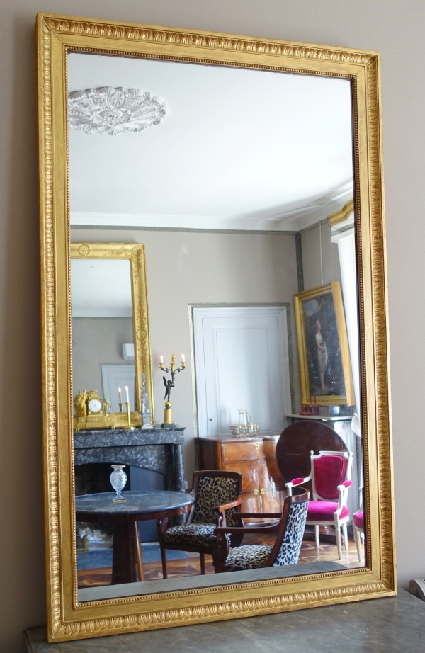 Grand miroir de cheminée Louis XVI Directoire doré à l'or fin, glace au mercure - 161cm x 102,5cm