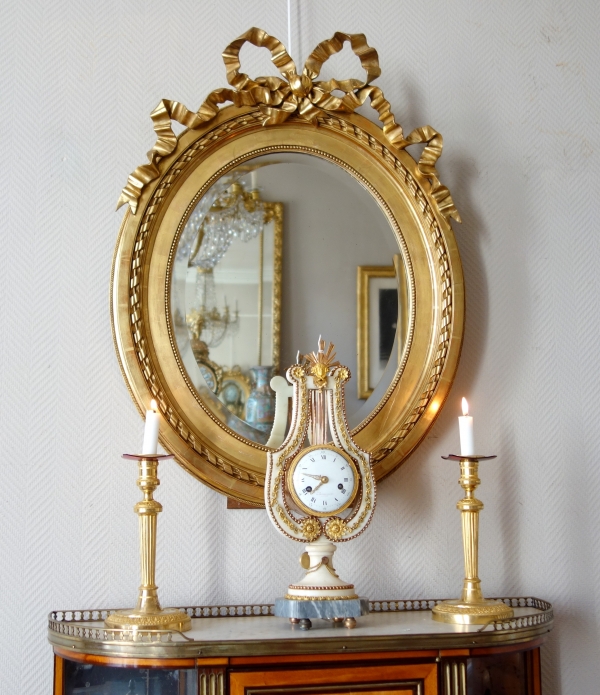 Large oval Louis XVI style mirror, gold leaf gilt wood frame, Napoleon III period - 84cm x 63cm