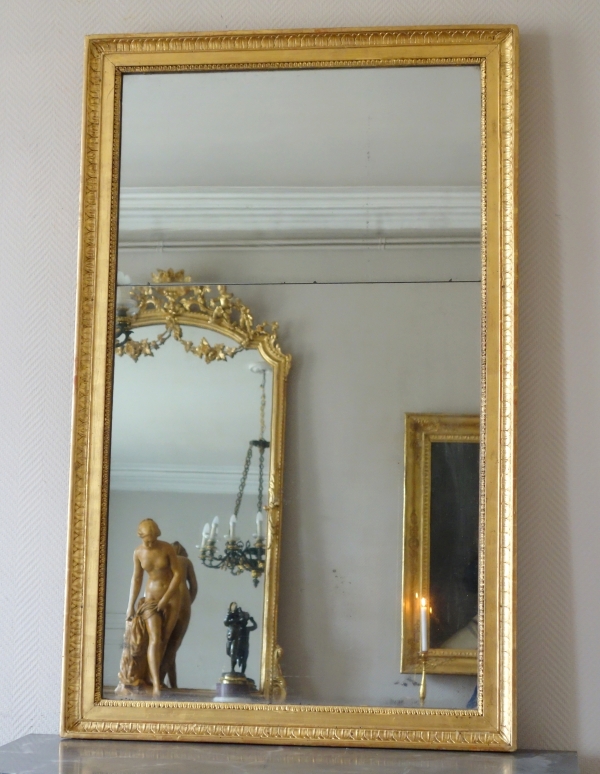 Miroir d'entre deux ou de cheminée d'époque Empire en bois doré, glace au mercure - 129cm x 80cm