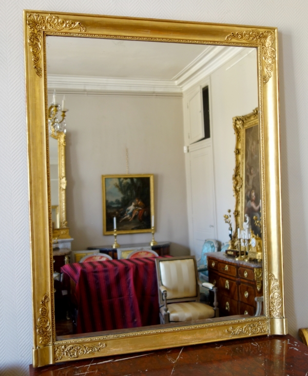 Grand miroir de cheminée Empire en bois doré à l'or fin, glace au mercure - 102,5cm x 130cm