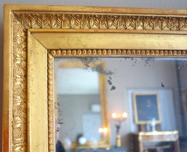 Miroir en bois doré feuille d'or et glace au mercure, époque Empire - 88cm x 72cm