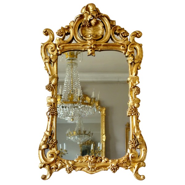 Miroir d'entre-deux en bois doré, glace au mercure, travail Provencal d'époque Louis XV Transition
