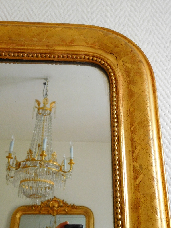 Miroir en bois doré à la feuille d'or, glace au mercure, époque Napoléon III