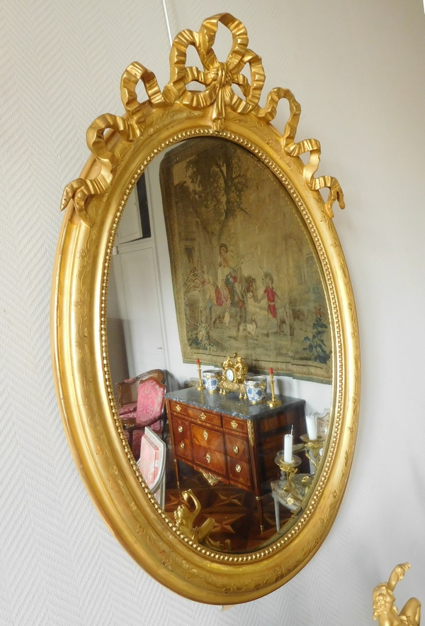 Grand miroir ovale de style Louis XVI, bois doré, glace au mercure - 69,5cm x 103cm