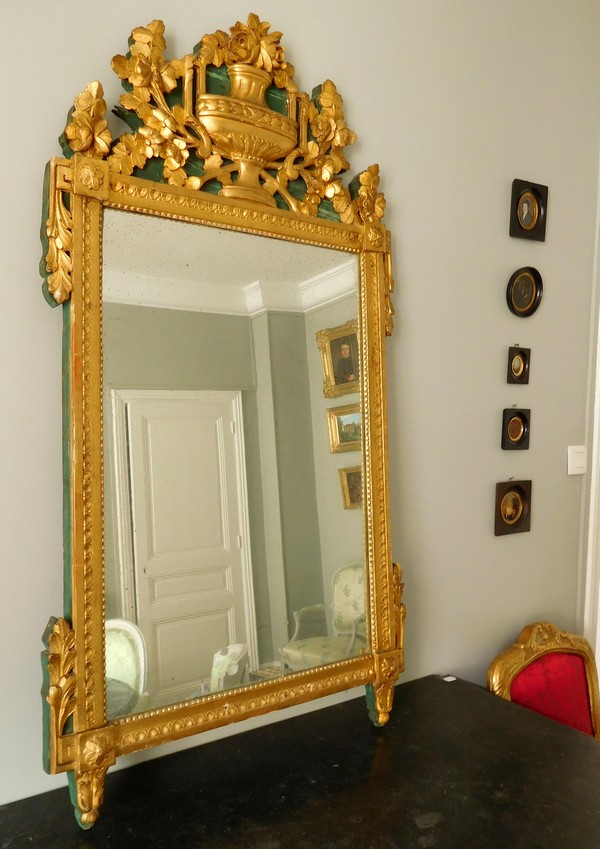 Tall mirror, Louis XVI period (late 18th century), frame gilt with gold leaf