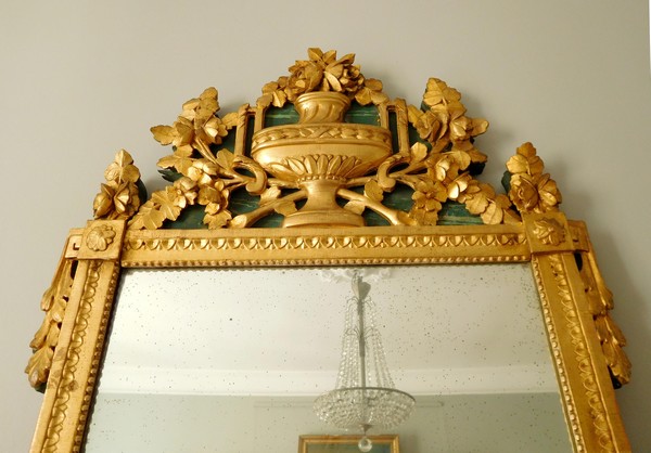 Tall mirror, Louis XVI period (late 18th century), frame gilt with gold leaf