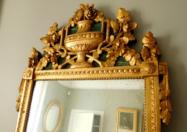 Tall mirror, Louis XVI period (late 18th century), frame gilt with gold leaf