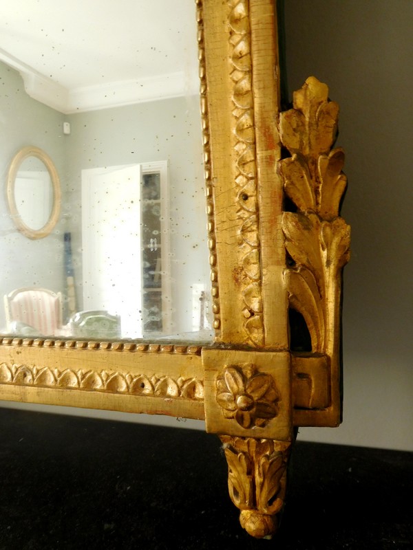 Tall mirror, Louis XVI period (late 18th century), frame gilt with gold leaf