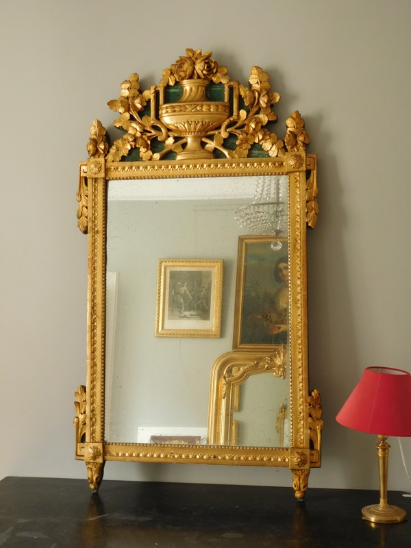 Tall mirror, Louis XVI period (late 18th century), frame gilt with gold leaf