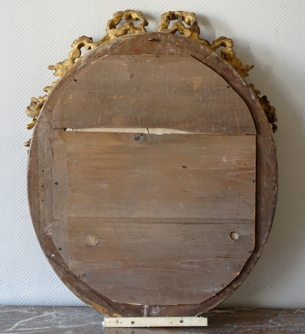 Grand miroir ovale de style Louis XVI en bois doré, époque Napoléon III - 78cm x 97,5cm