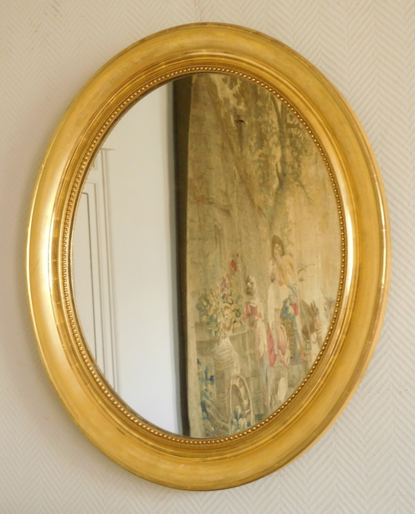 Miroir ovale XIXe en bois doré à la feuille d'or - glace au mercure - 76,5cm x 75cm