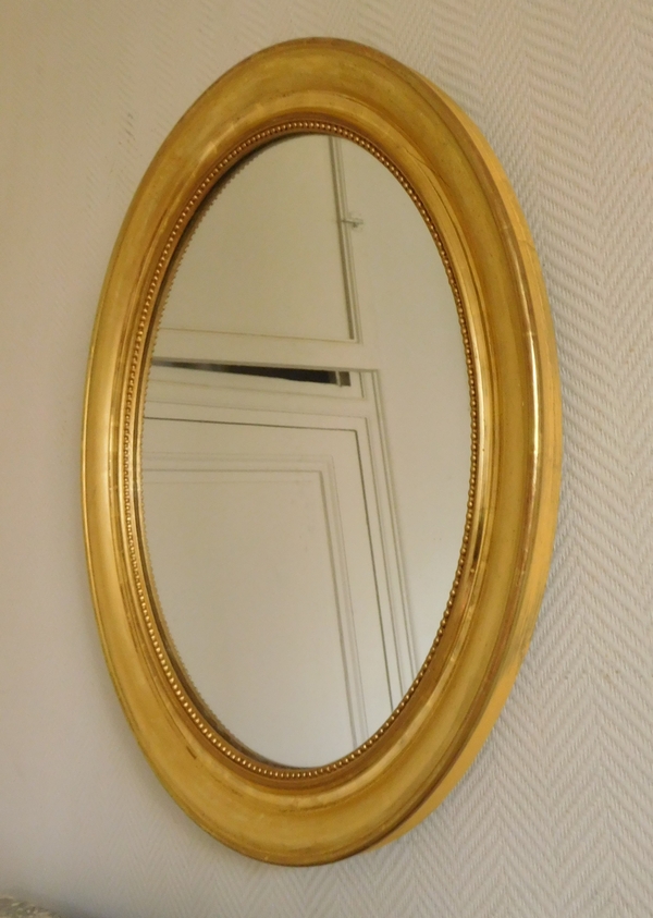 Miroir ovale XIXe en bois doré à la feuille d'or - glace au mercure - 76,5cm x 75cm