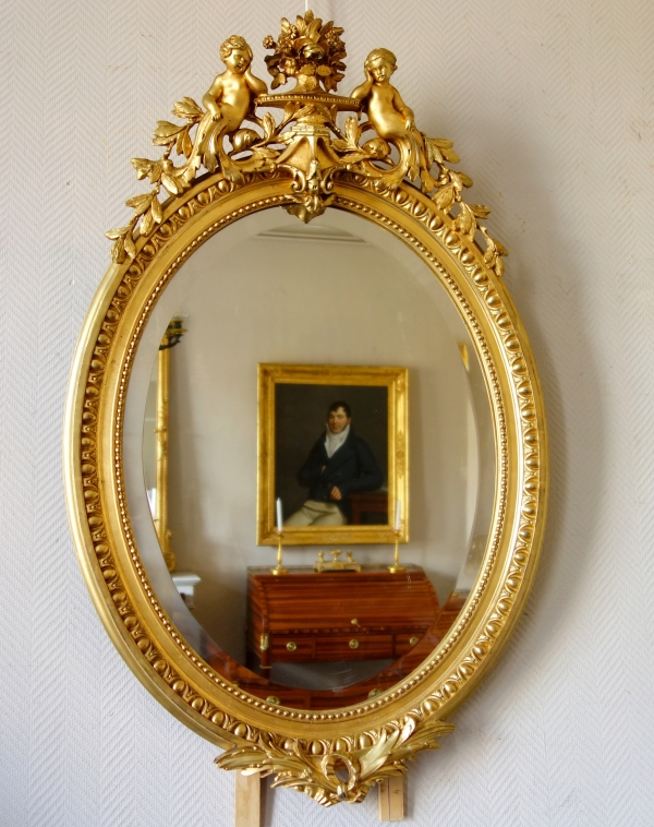 Miroir ovale de style Louis XVI en bois doré, époque Napoléon III - 71cm x 111cm