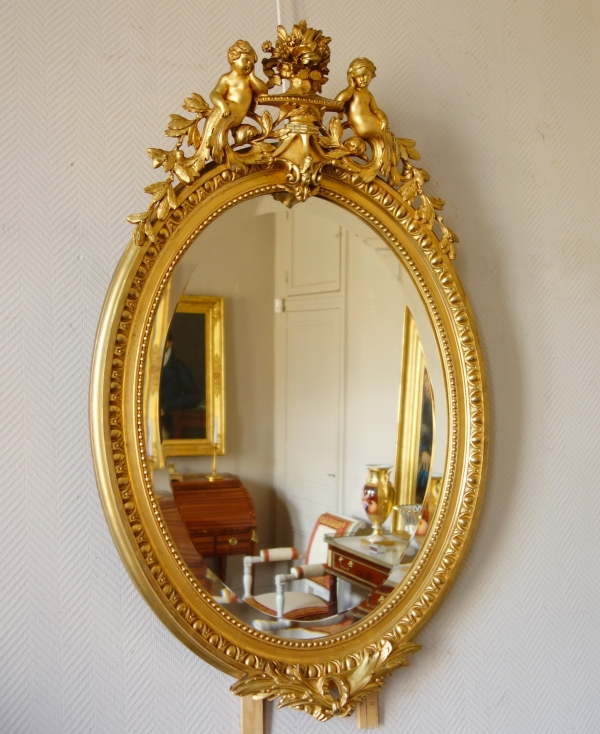 Miroir ovale de style Louis XVI en bois doré, époque Napoléon III - 71cm x 111cm