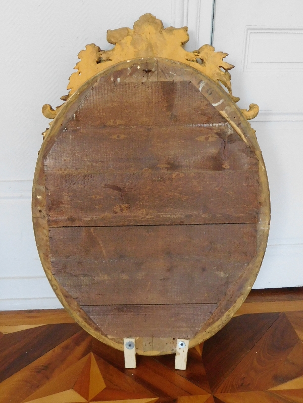 Miroir ovale en bois doré à la feuille d'or d'époque Napoleon III - 62cm X 95cm