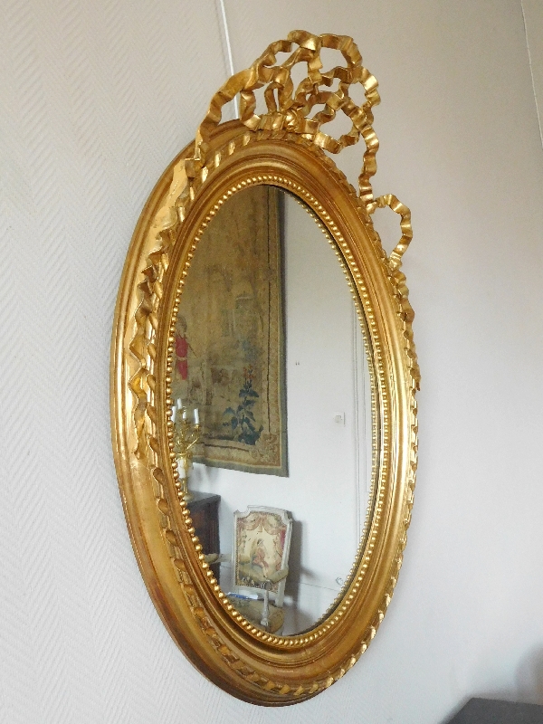 Louis XVI style gilt wood oval mirror, Napoleon III period - 86cm x 112cm